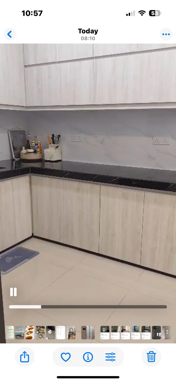 Kitchen features: light wood cabinetry, black granite countertop, white marble backsplash, built-in sink, stainless-steel faucet, ceramic tile flooring, under-cabinet lighting, open shelving, kitchen mat, wall-mounted spice rack, appliance garage, multiple storage drawers; style: modern.